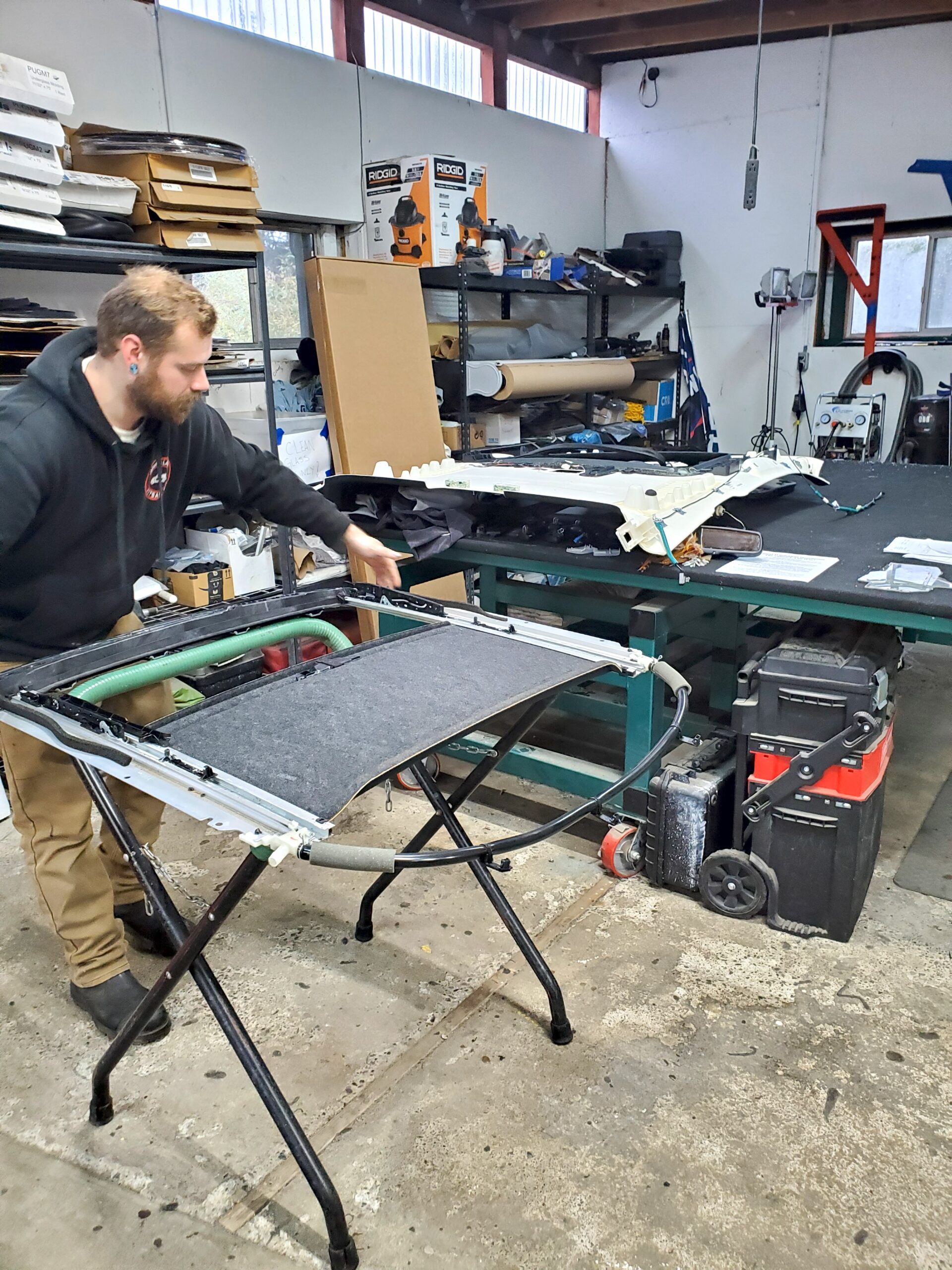 Noah setting down sunroof assembly