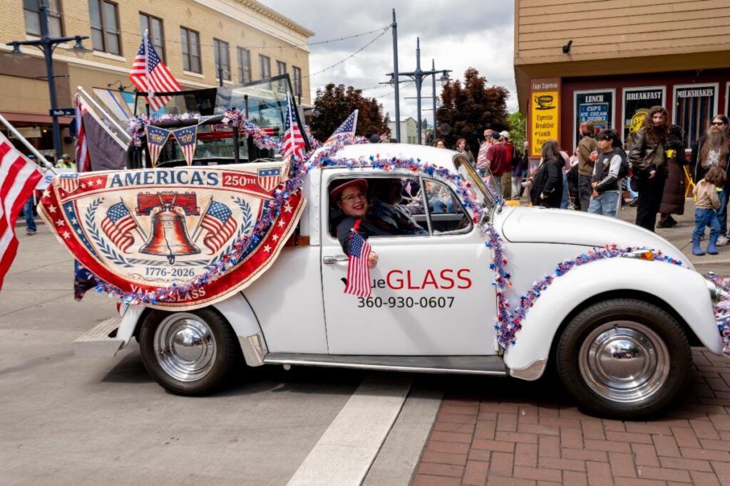 valueGLASS’s Buck Volkswagen pickup decorated with American flags at a local parade